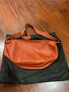 Carla Rockmore Crossbody moon shaped Bag in Burnt Orange